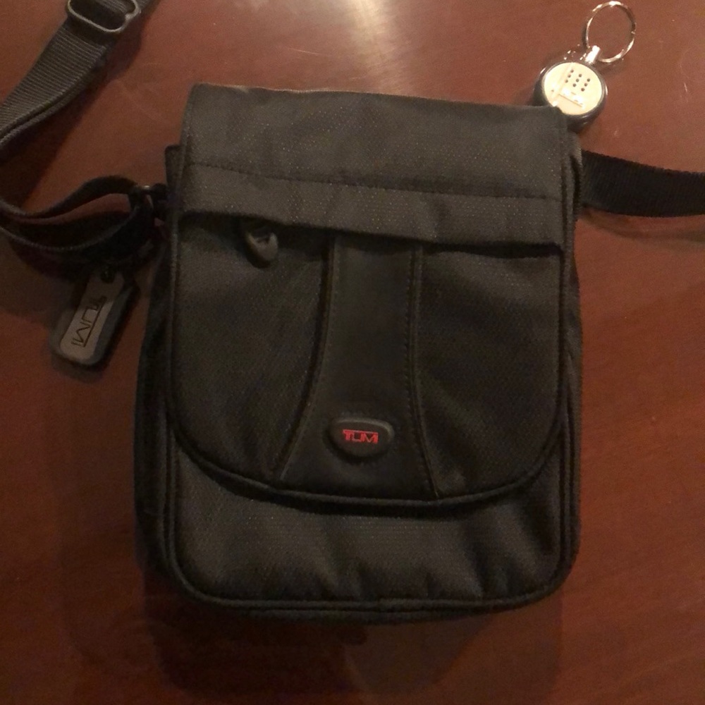 Gorgeous Tumi camera/crossbody  bag. Never used.
